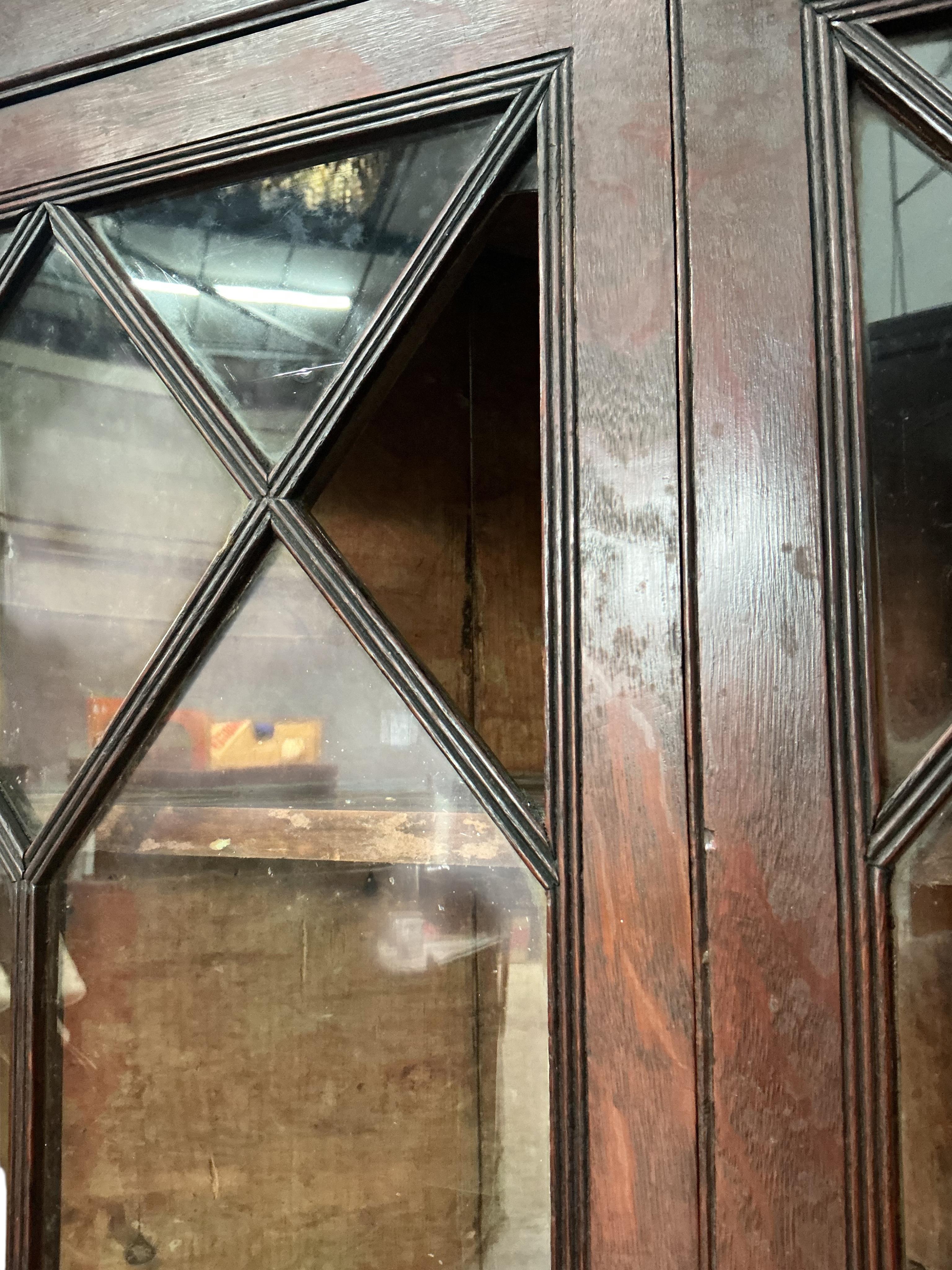 A George III oak standing corner cupboard (one glass panel missing), width 104cm, depth 57cm, height 200cm